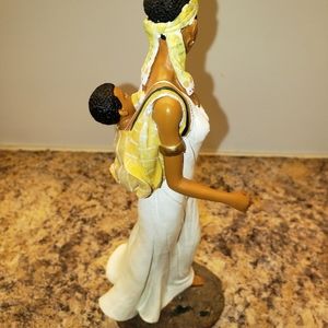Ceramic Lady carry a baby on her back brown bass botton
